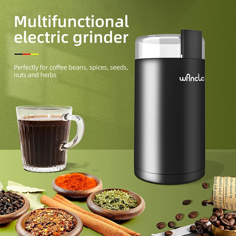 Moulin à café électrique noir avec tasse de café et épices